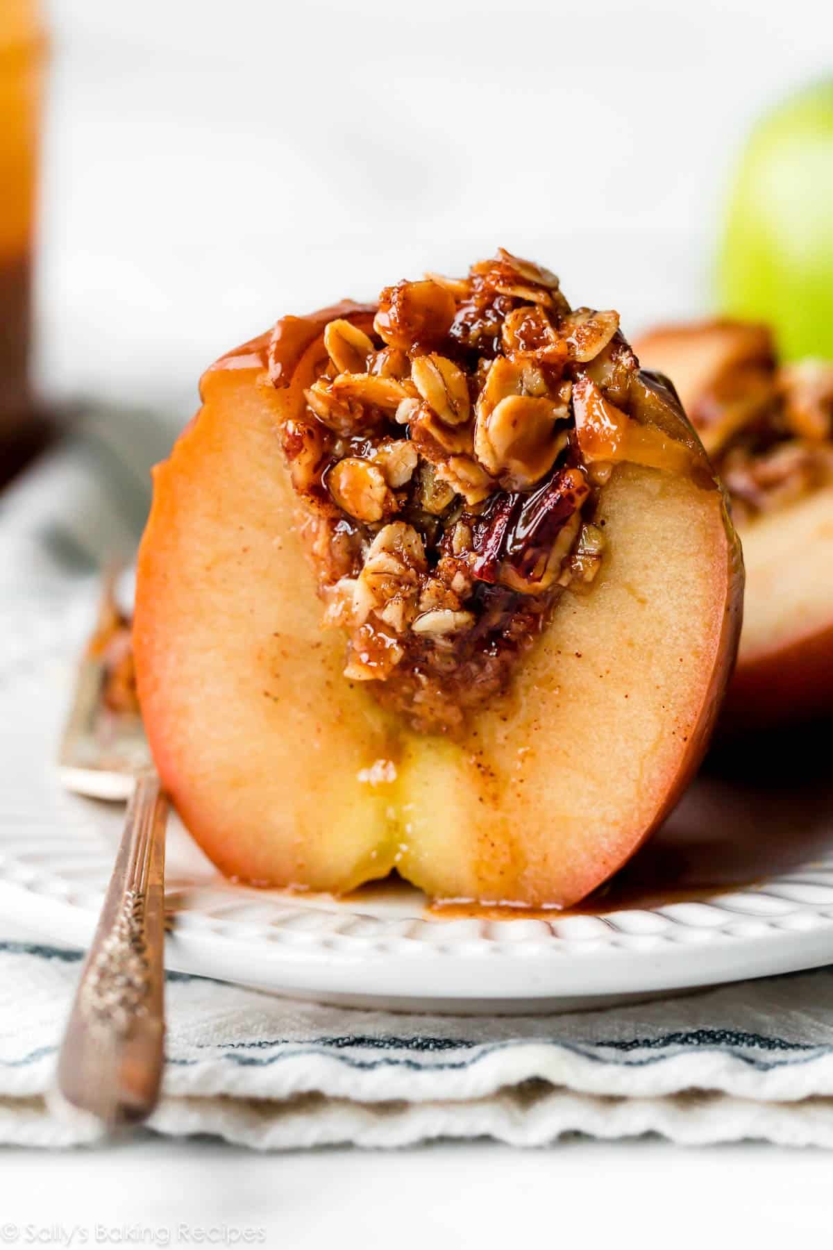 baked apple half with brown sugar oat filling inside.