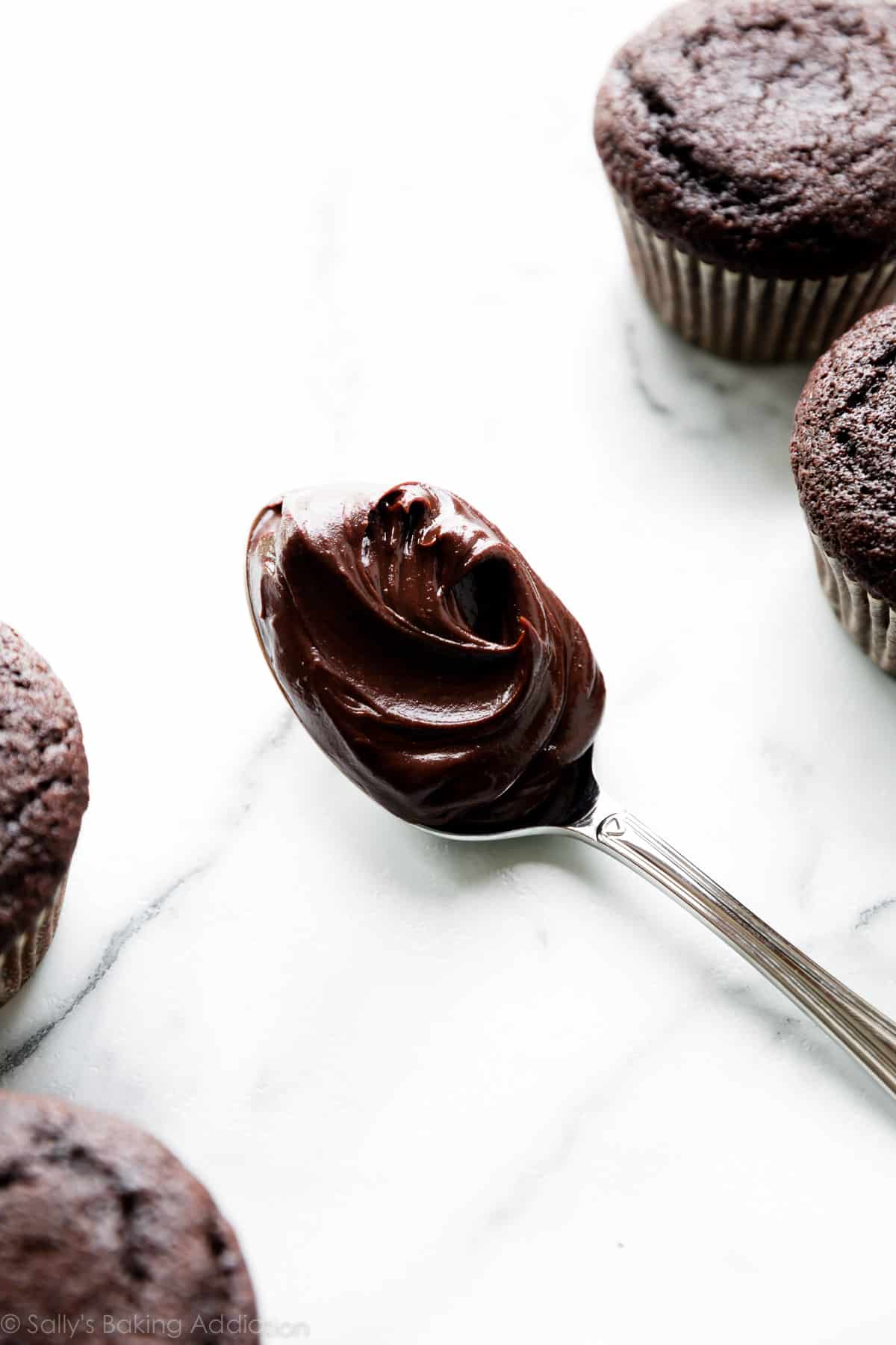 thickened chocolate ganache on spoon