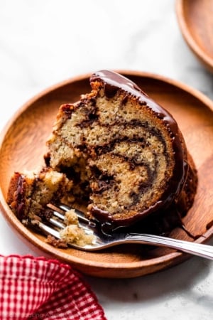 slice of chocolate marble banana bundt cake on plate