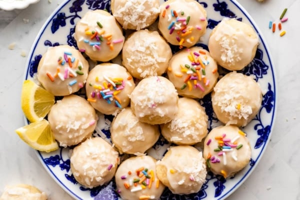 lemon coconut shortbread drop cookies with glaze and sprinkles on top