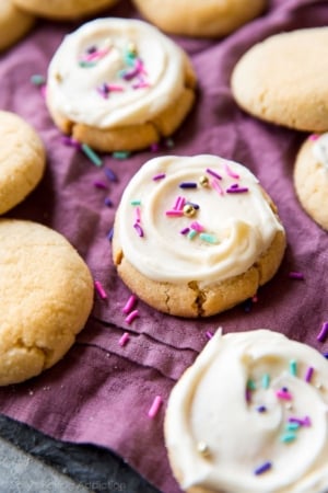 cream cheese sugar cookies topped with cream cheese frosting and sprinkles