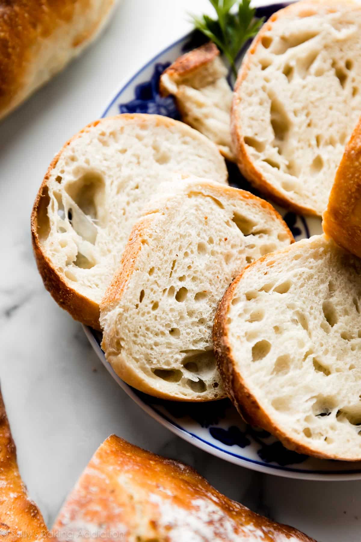 slices of homemade artisan french bread on a plate