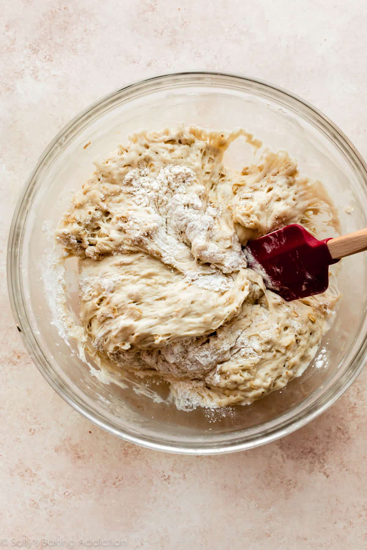 folding extra flour into bread dough