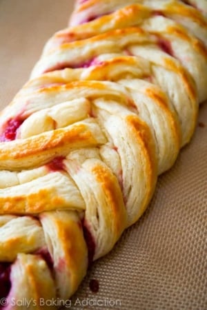 close-up photo of a pastry braid with raspberry filling