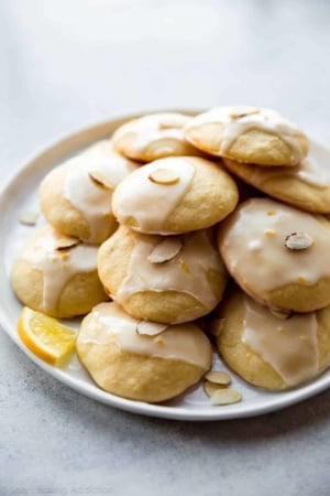 lemon ricotta cookies stacked on a white plate