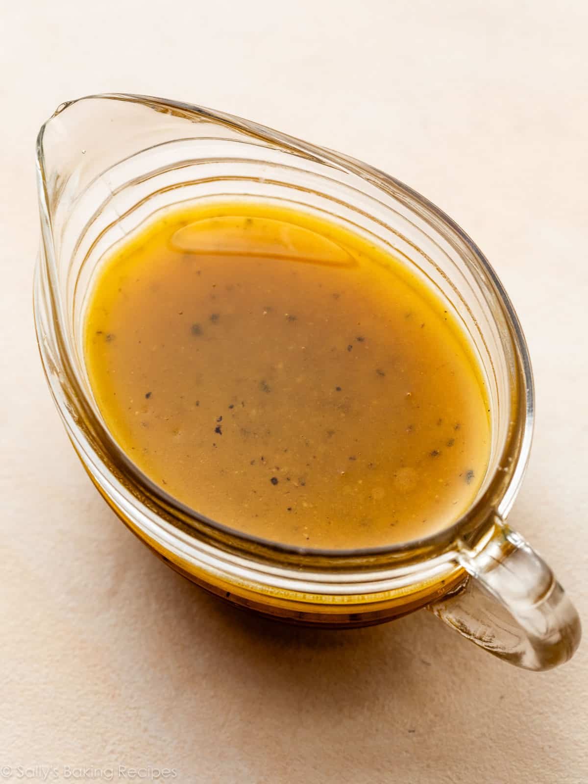 maple vinaigrette dressing in small glass gravy boat.