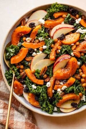 maple-roasted and seasoned butternut squash and chickpeas on fall kale salad.