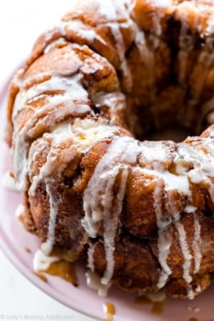 monkey bread with icing on pink cake stand