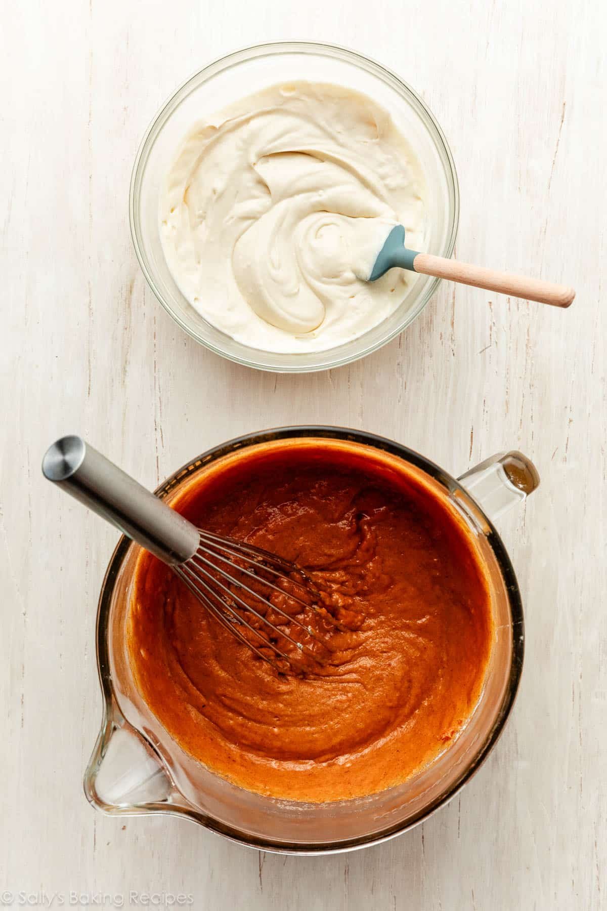 two batters in glass bowls including pumpkin and cream cheese.