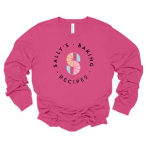 Sally's baking recipes logo long sleeve shirt in charity pink.