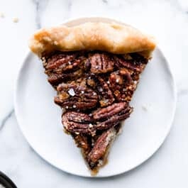 slice of maple pecan pie on a white plate