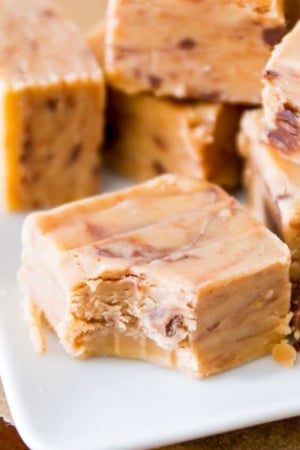 squares of peanut butter fudge with a bite taken out of one piece